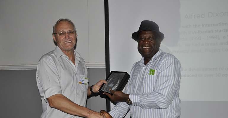 L-R: Dr Wolfgang Pfeiffer, Deputy Director (Operations), HarvestPlus presenting an award to Dr Alfred Dixon…in Abuja, Nigeria