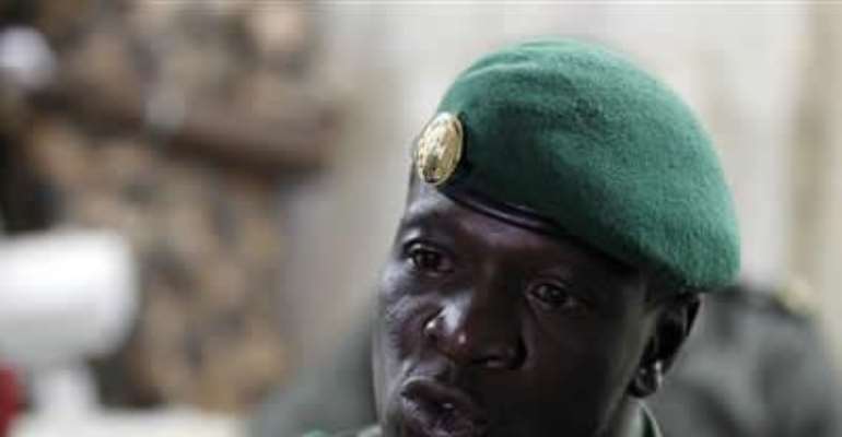MALI'S JUNTA LEADER CAPTAIN AMADOU SANOGO SPEAKS TO THE MEDIA AFTER AGREEING TO HAND OVER POWER TO THE PRESIDENT OF THE NATIONAL ASSEMBLY, AT A MILITARY BASE IN KATI APRIL 7, 2012.
