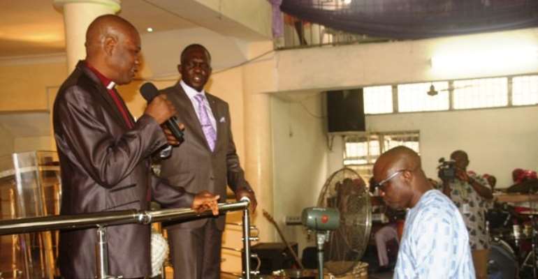 Governor Emmanuel Uduaghan of Delta State being prayed for by Rev. Sylvester Ogheneakpobo (left) and Pastor Odunayo Oke during a church service at the Avenue Baptist Church in Warri. Pix: Bripin Enarusai