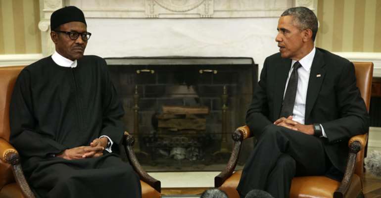 President Obama speaks and President Buhari listens