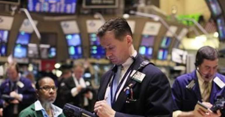 TRADERS WORK ON THE FLOOR OF THE NEW YORK STOCK EXCHANGE, AUGUST 16, 2011.