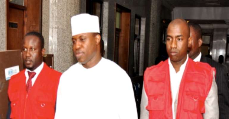 FORMER SPEAKER DIMEJI BANKOLE SANDWICHED BY EFCC OPERATIVES AT THE FEDERAL HIGH COURT, ABUJA TODAY, JUNE 08, 2011.