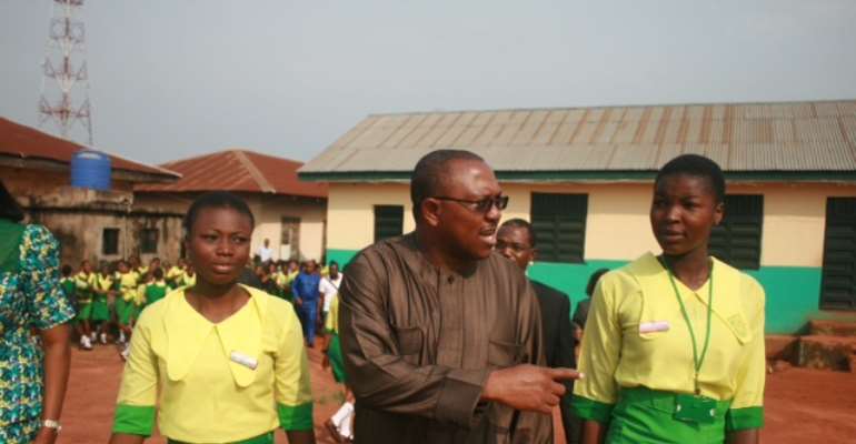 Gov. Peter Obi (middle), flanked by the the Senior Prefect of Eastern Academy, Chukwuneke Vivian Ogechukwu (right) and  her Ass