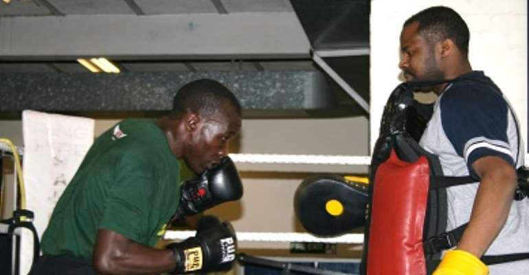 Photos, Badru Lusambya prepares for Friday Commonwealth Title; Danny Lutaaya takes him into several drills.
