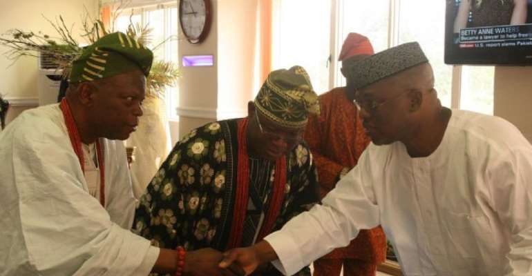 Ekiti State Governor, Engr. Segun Oni, in a warm handshake with the
Onitaji of Itaji Ekiti, Oba Adamo Babalola