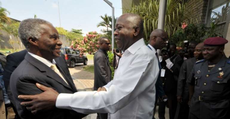 Gbagbo greets Mbeki during negotiations in Ivory Coast