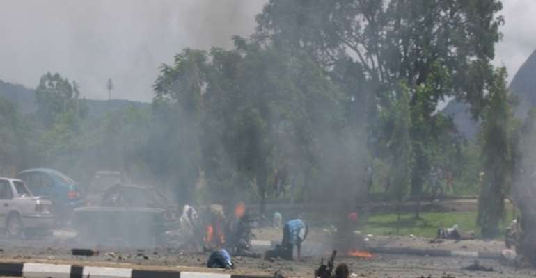 A SECOND IED PLANTED IN A VEHICLE EXPLODES AS EMERGENCY WORKERS RESPONDED TO THE FIRST EXPLOSION ON NIGERIA'S 50TH INDEPENDENCE DAY CELEBRATION IN CAPITAL ABUJA ON OCTOBER 01, 2010.