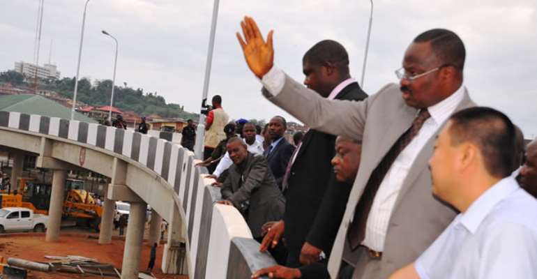 GOVERNOR ABIOLA AJIMOBI OF OYO STATE (2ND R) & LI CAO, PROJECT MANAGER OF CCECC, DURING THE GOVERNOR'S INSPECTION OF THE MOKOLA BRIDGE IN IBADAN. APRIL 22, 2013