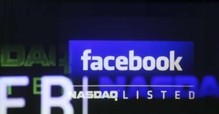 THE FACEBOOK LOGO IS SEEN ON A SCREEN INSIDE AT THE NASDAQ MARKETSITE IN NEW YORK IN THIS MAY 18, 2012, FILE PHOTO