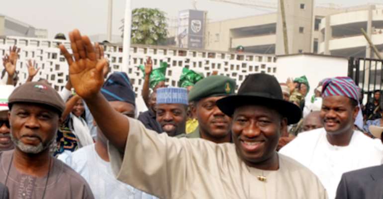 A FILE PHOTO SHOWS PRESIDENT GOODLUCK EBELE JONATHAN WAVING TO SUPPORTERS AT THE PRESIDENTIAL WING OF THE MURTALA MUHAMMED AIRPORT LAGOS.