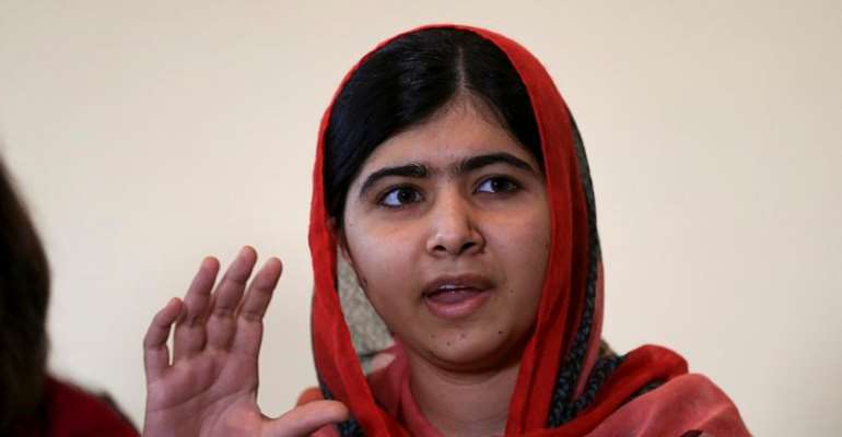 Taliban survivor Malala, in Nigeria, pledges to help free girls