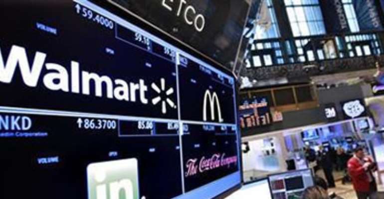 A BOARD SHOWS STOCK PRICES FOR WALMART, LINKEDIN, MCDONALD'S AND COCA-COLA AT THE BOOTH THEY ARE TRADED ON THE FLOOR OF THE NEW YORK STOCK EXCHANGE, MARCH 6, 2012.