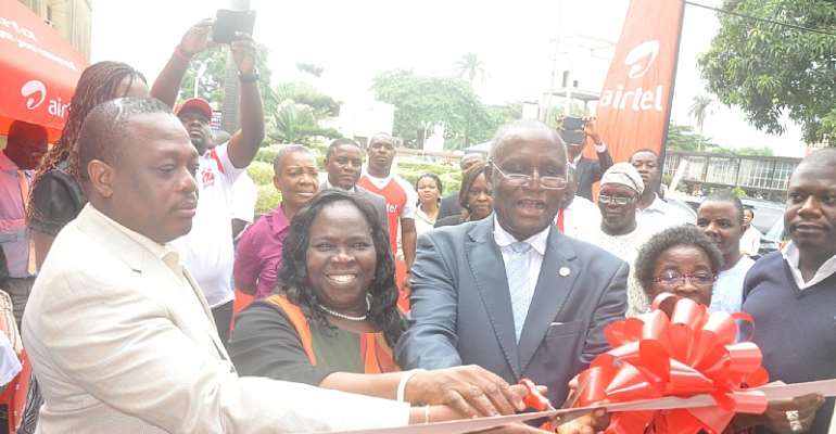 Deputy Vice Chancellor, Management, Unilag, Prof. Duro Oni cutting the tape to open the new Airtel's Service Point at the University of Lagos