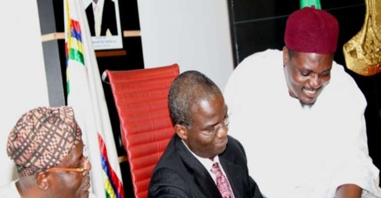 PHOTO: LAGOS STATE GOVERNOR, MR BABATUNDE FASHOLA, SAN (M) SIGNING THE LAGOS MORTGAGE AND PROPERTY BILL INTO LAW AT THE CONFERENCE ROOM, LAGOS HOUSE, IKEJA, TODAY, MONDAY, AUGUST 23, 2010.