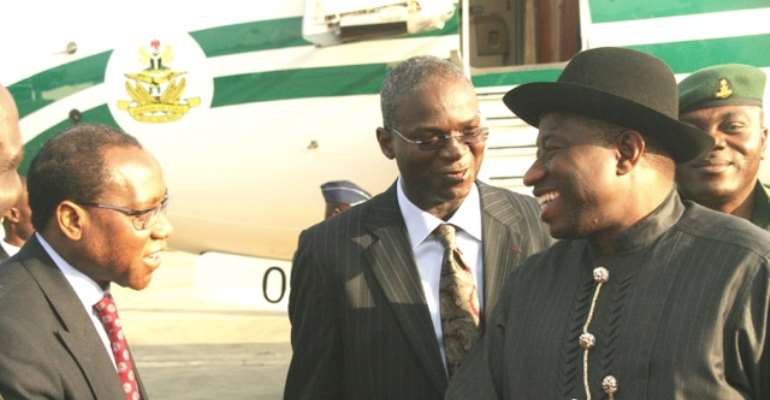 PRESIDENT GOODLUCK JONATHAN IS RECEIVED BY LAGOS STATE GOVERNOR BABATUNDE FASHOLA AND TRADE AND INVESTMENT MINISTER (SHAKING JONATHAN'S HAND) AT THE VIP WING OF THE MURTALA MUHAMMED AIRPORT ON MONDAY, JULY 18, 2011.