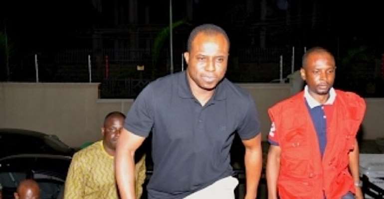 FORMER HOUSE SPEAKER DIMEJI BANKOLE WITH EFCC OPERATIVES ON THE NIGHT OF HIS ARREST IN ABUJA.