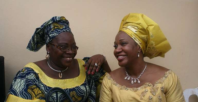 The wife of Anambra State Governor, Mrs Margaret Peter-Obi (right), with one of the women that came to celebrate mothering Sunday with her at the Governor's Lodge.