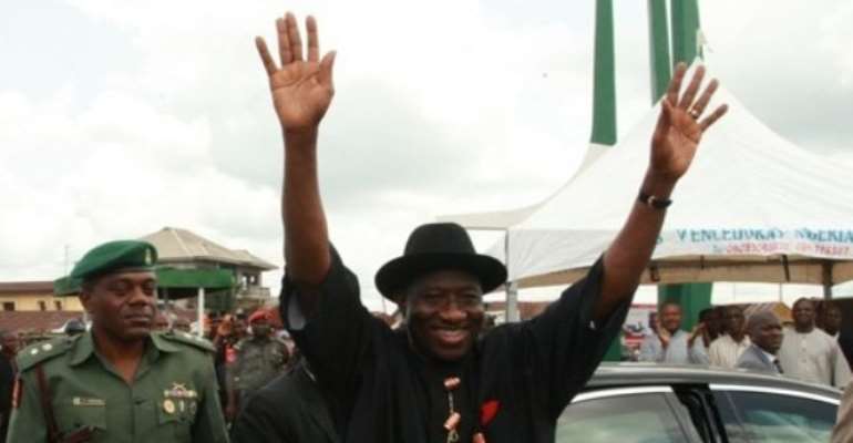 PHOTO: PRESIDENT GOODLUCK JONATHAN ACKNOWLEDGES CHEERS FROM A CROWD DURING HIS RECENT VISIT TO RIVERS STATE.
