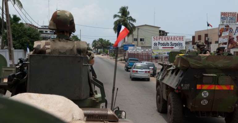 French soldiers are shown patrolling as part of the French Force Licorne in Port Bouet district of Abidjan, Ivory Coast on Saturday.