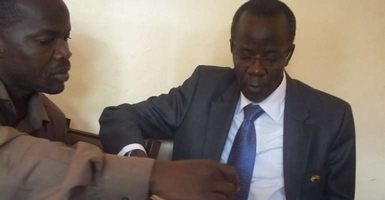 Member of Parliament, Uganda, Alhaj Hussein Kyanjo reading through Islamic Museum Files