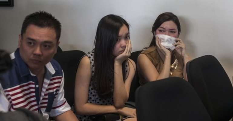 Anxious family members wait for news at the airport in Surabaya<br />Anxious family members have been arriving at the airport in Surabaya