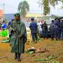 Police officers inspect the scene of a bombed explosion in Beni, Democratic Republic of Congo in December 2021. On May 18, 2022, the head of the National Intelligence Agency detained three journalists and ordered his officers to strip and beat them. (AP P