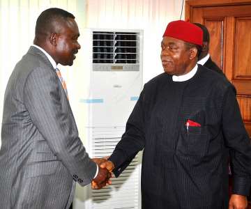 Gov. Theodore Orji of Abia State in a handshake with Sir Chris Nkwonta, Chairman Abia state oil subsidy reinvestment committe after their inauguration in Umuahia.