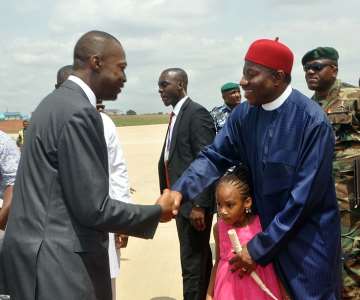 GOV SULLIVAN CHIME OF ENUGU STATE  (L) WELCOMING PRESIDENT GOODLUCK JONATHAN TO THE FOUNDATIONLAYING OF THE NEW INTERNATIONAL TERMINAL AND THE INAUGURATION OF THE REMODELLED TERMINAL OF AKANUIBIAM INTERNATIONAL AIRPORT ENUGU ON SATURDAY (18/5/13).