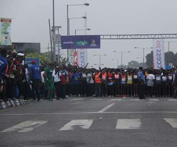 ATHLETES AT THE START LINE AT THE NATIONAL STADIUM