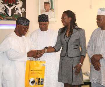 Ekiti State Governor, Engr. Segun Oni, receiving a gift from the Executive Secretary, MTN Foundation, Ms Nonny Ugboma while Director of the MTN Foundation, Prince Julius Adelusi-Adeluyi and Speaker of the State House of Assembly, Rt. Hon. Olatunji Odeyemi watch with interest