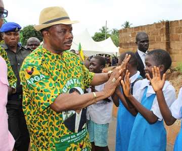 Chief Willie Obiano, Executive Governor, Anambra State being received by school children on arrival during an Inspection Tour of a road construction project in Nando, Anambra East LGA...Wednesday.