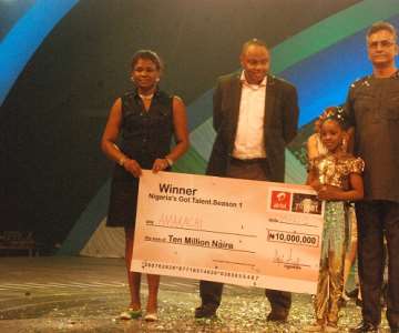 (l-r)Mother of Nigeria''s Got Talent (NGT) Season One, Mrs. Uyanne, CEO, Rapid Blue Format and Optima Media, Mr. Rotimi Pedro, MD/CEO, Airtel Nigeria, Rajan Swaroop and NGT Season One Winner, Amarachi Uyanne on stage shortly after the 8 years old received the cheque of N10 Million grand prize at the OMG Studio in Lagos....Saturday
