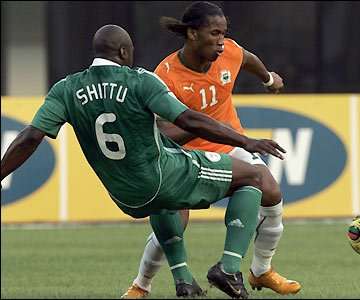 Elephants striker Didier Drogba looks for an early breakthrough but finds Danny Shittu in the way  SOURCE: AP