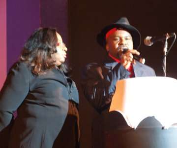 Sunny McDon and Madam Peace Anyiam Osigwe making a presentation on the stage.
