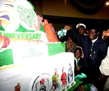 PRESIDENT GOODLUCK JONATHAN CUTTINMG THE 50TH ANNIVERSARY CAKE TODAY FRIDAY AT THE STATE HOUSE IN ABUJA