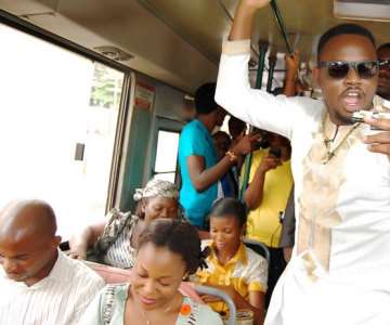 Surprise, Surprise: Dr SID giving out airtime to commuters in a BRT bus, in Lagos.