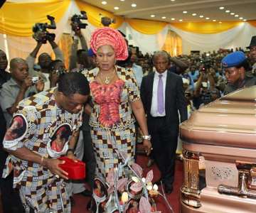 Chief Willie Obiano, Governor of Anambra State, paying his last respect to the body of Prof. Dora Akunyili at the Special Honours & Tributes Ceremony in Awka...Wednesday. With him is Ebelechukwu, his wife.