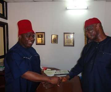Former Minister of Interior Capt Emmanuel Ihenacho (L) being welcomed to the All Progressives Grand Alliance (APGA) National Secretariat Abuja by the party''s when the former minister went to obtain his Governorship Nomination and Expression of Interest forms to the All Progressives Grand Alliance (APGA) National Chairman Chief Victor Umeh at APGA National Secretariat Abuja.
