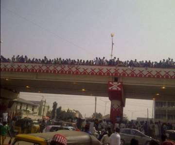CROWD ON THE NEWLY BUILT BRIDGE IN KANO
