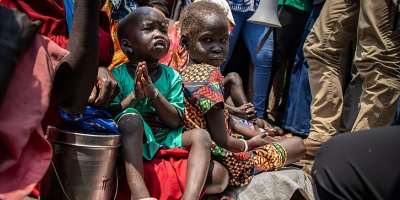 UNOCHA/Adedeji Ademigbuji: Children displaced by the recent violence in Jonglei State, South Sudan, sit outside a church, home to thousands of displaced people