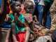 UNOCHA/Adedeji Ademigbuji: Children displaced by the recent violence in Jonglei State, South Sudan, sit outside a church, home to thousands of displaced people