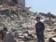 UN News: A child walking among the rubble in the city of Gaza