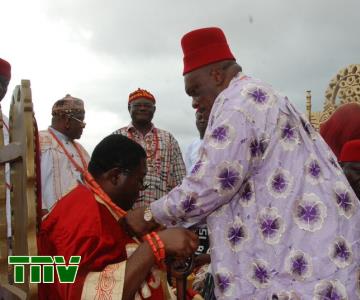 One of the Traditional Rulers wearing Imo Deputy Governor, Prince Eze Madumere a Royal neckless during his conferment of a title as OHAMADIKE of Owerri zone