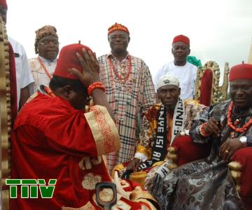The Chairman of Owerri Zone Traditional Rulers Council, HRH, Eze Chidume Okoro wears Prince Madumere, leader of Owerri zone and Deputy Governor of Imo State the Royal cap during the latter''s conferment of the title, OHAMIDE-Owerri zone