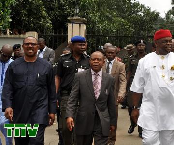 Gov. Peter Obi of Anambra state, Gov. Theodore Orji of Abia state and Chief Emeka Wogu, Minister for Labour and Productivity (rep. president Jonathan) departing from the venue after a Church service marking the conference of catholic bishops'' of Nigeria in Umuahia.
