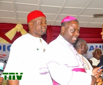 Gov. Theodore Orji of Abia state exchanging pleasantries with the President, Conference of catholic bishops of Nigeria, and Bishop of Jos, Bishop Ignatius Kaigama during  the opening ceremony of catholic bishops'' conference at the Bishop Nwedo Episcopal centre in Umuahia, watching is Chief Emeka Wogu, Minister for Labour and Productivity (rep. president Jonathan).